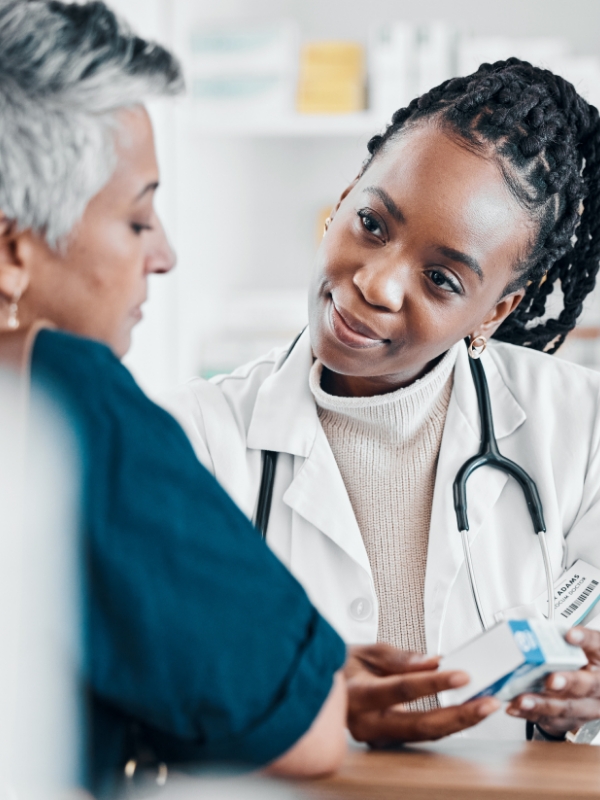 A female doctor talking to a female patient.